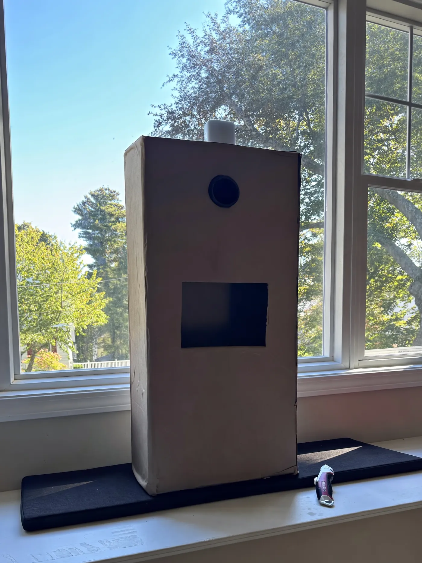 The very first Mochi booth, made from a cardboard box